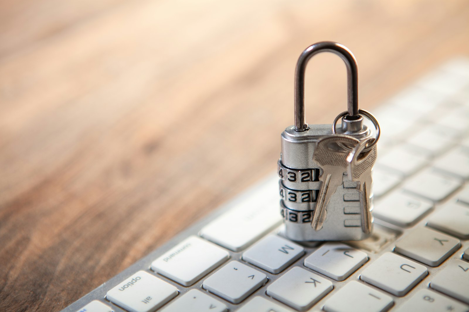 Padlock and keys resting on a computer keyboard