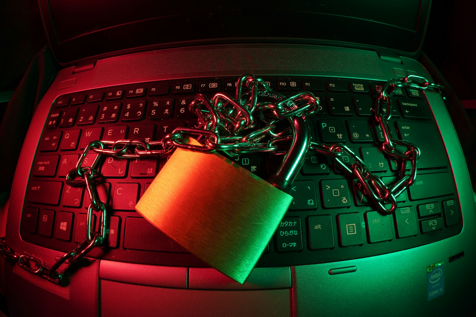 Brown padlock on black computer keyboard