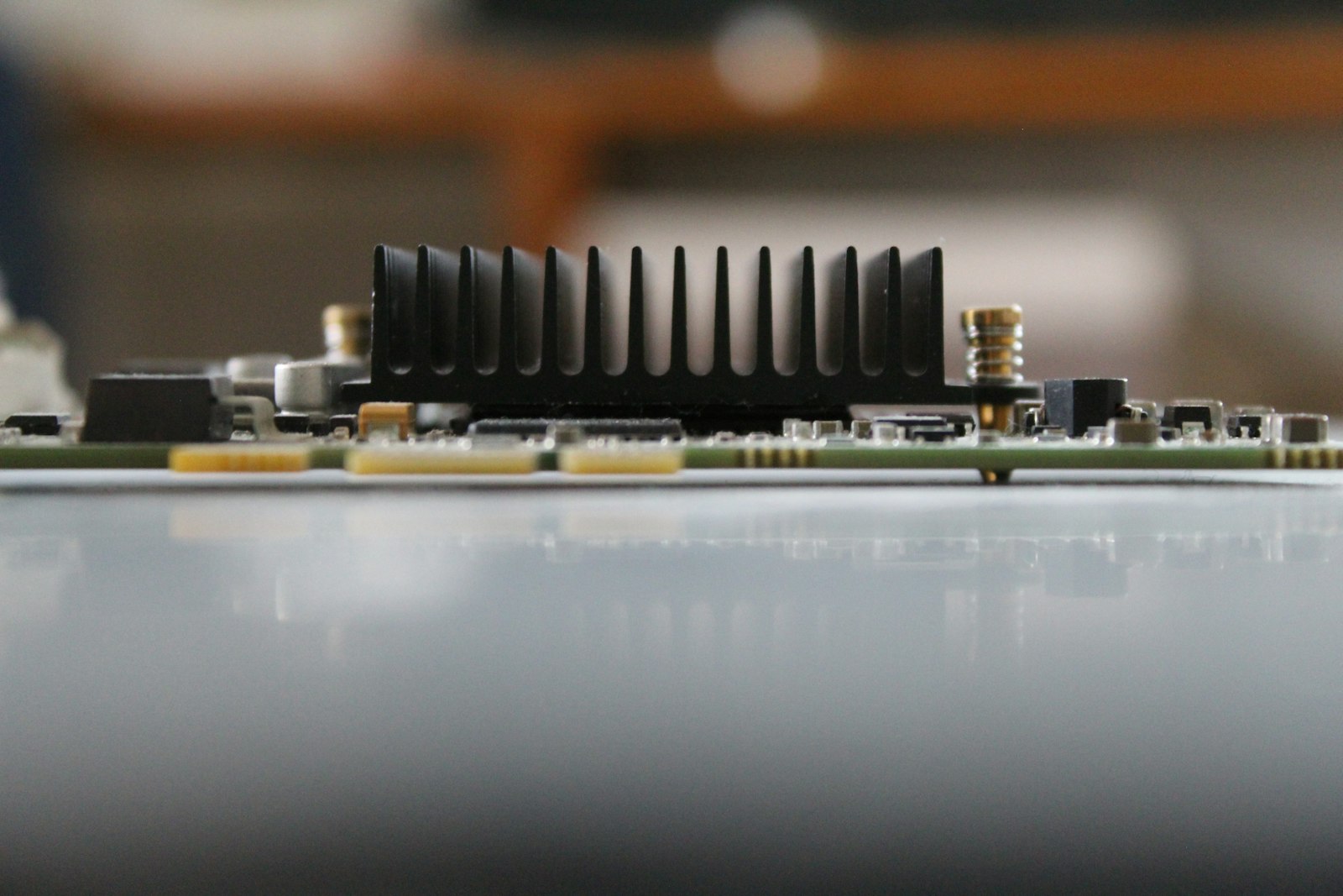 A close up of a motherboard with many screws