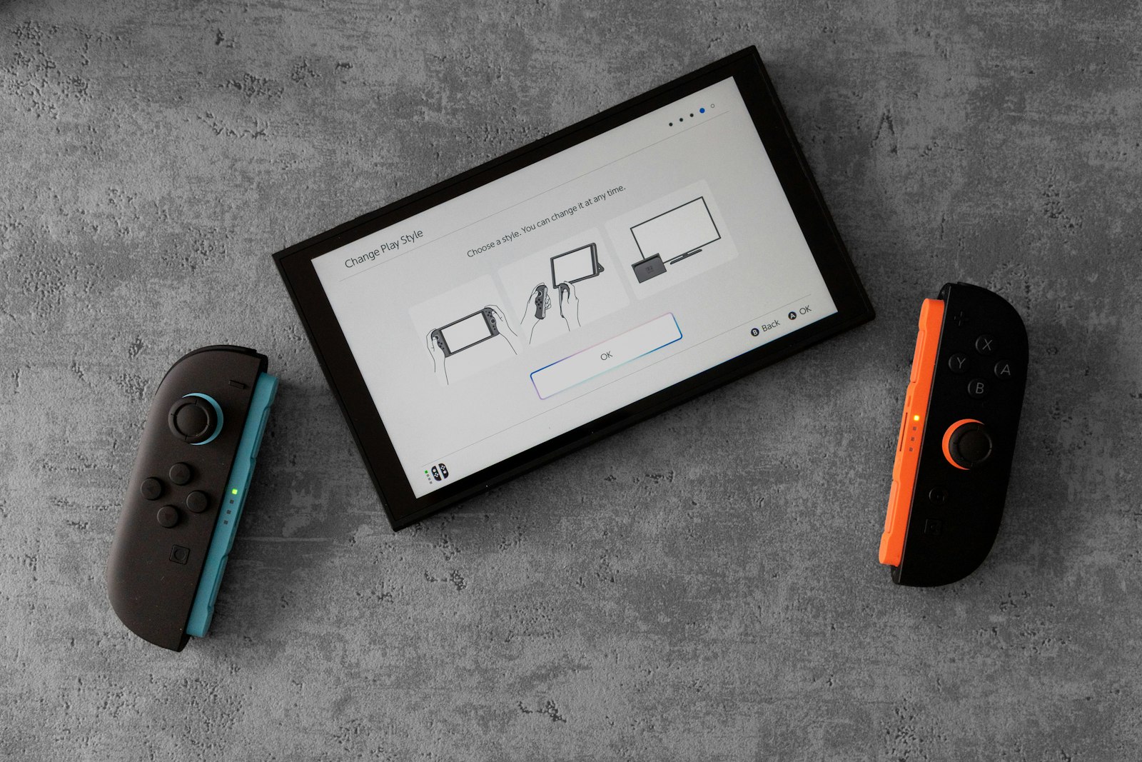 A nintendo switch console and controllers are displayed.