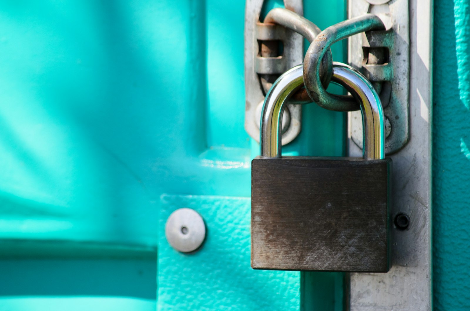 A close up of a padlock on a door