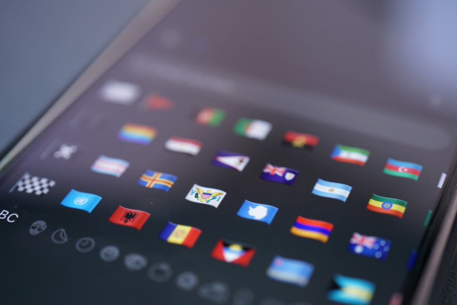 Flags appear on a smartphone's keyboard