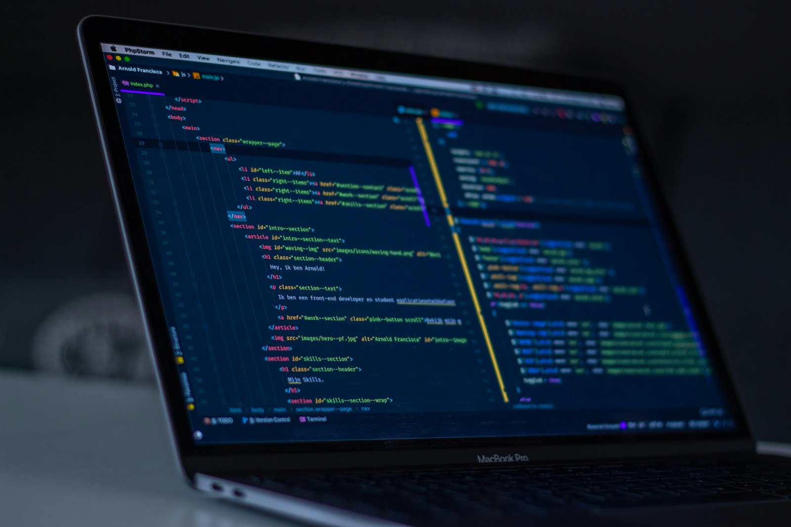 Turned-on MacBook Pro wit programming codes display