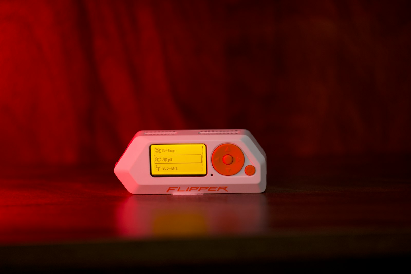 A small digital music player on a dark surface