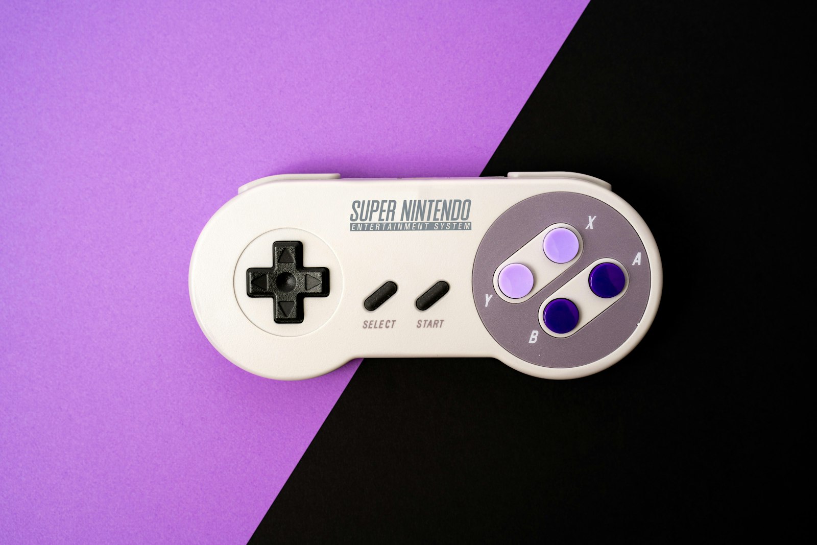white and black game controller