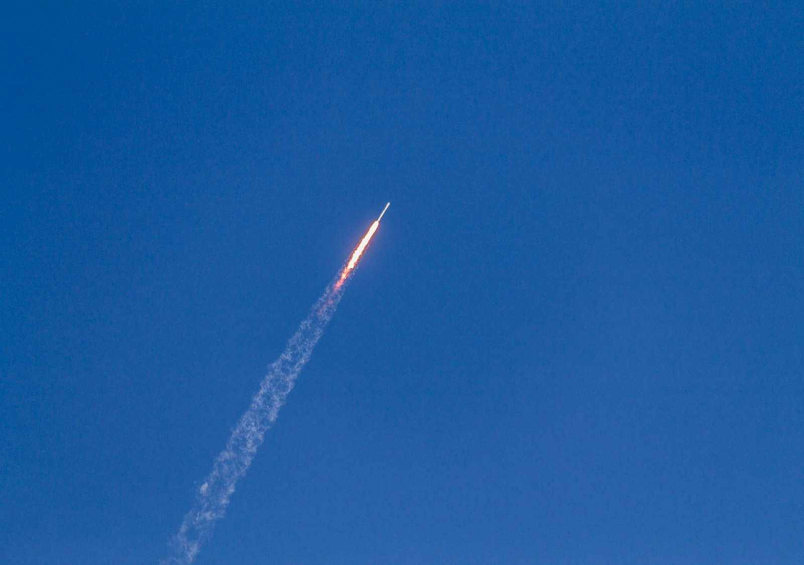 Flying rocket during daytime