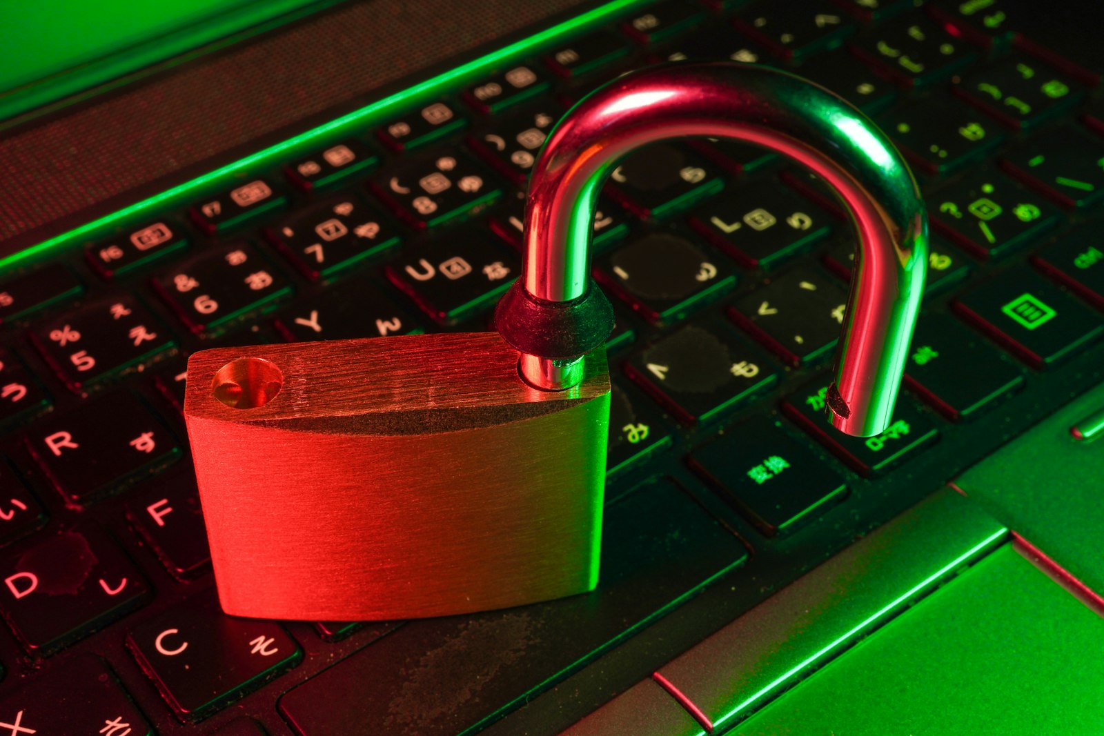Red padlock on black computer keyboard