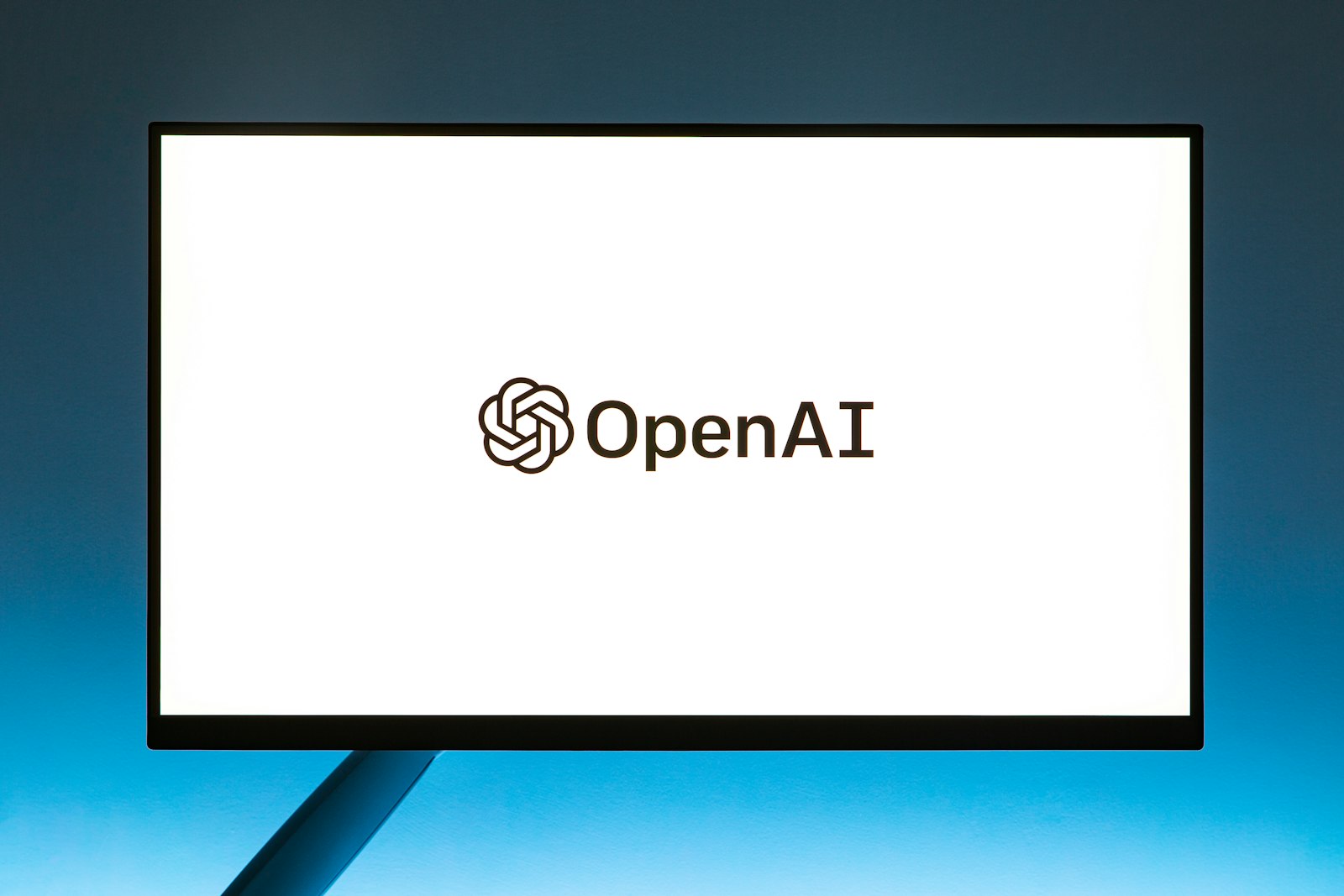 A computer screen with the open ai logo on it