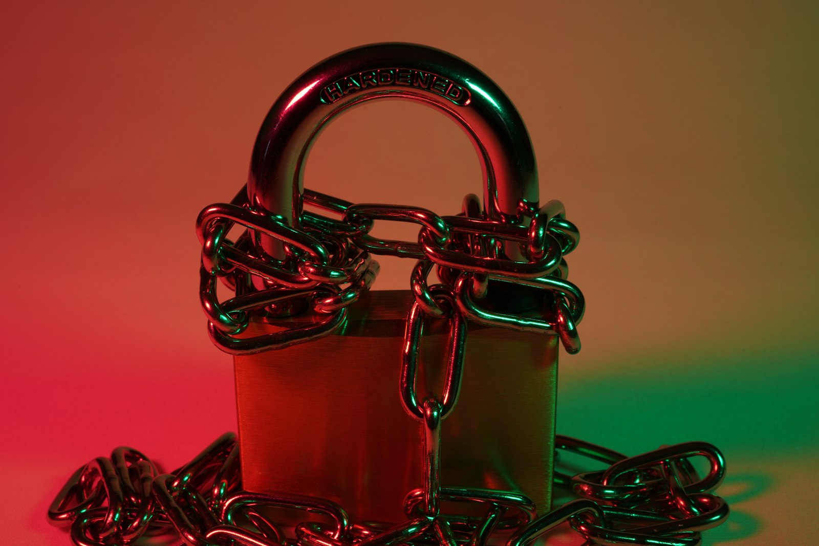 Red padlock on red metal chain