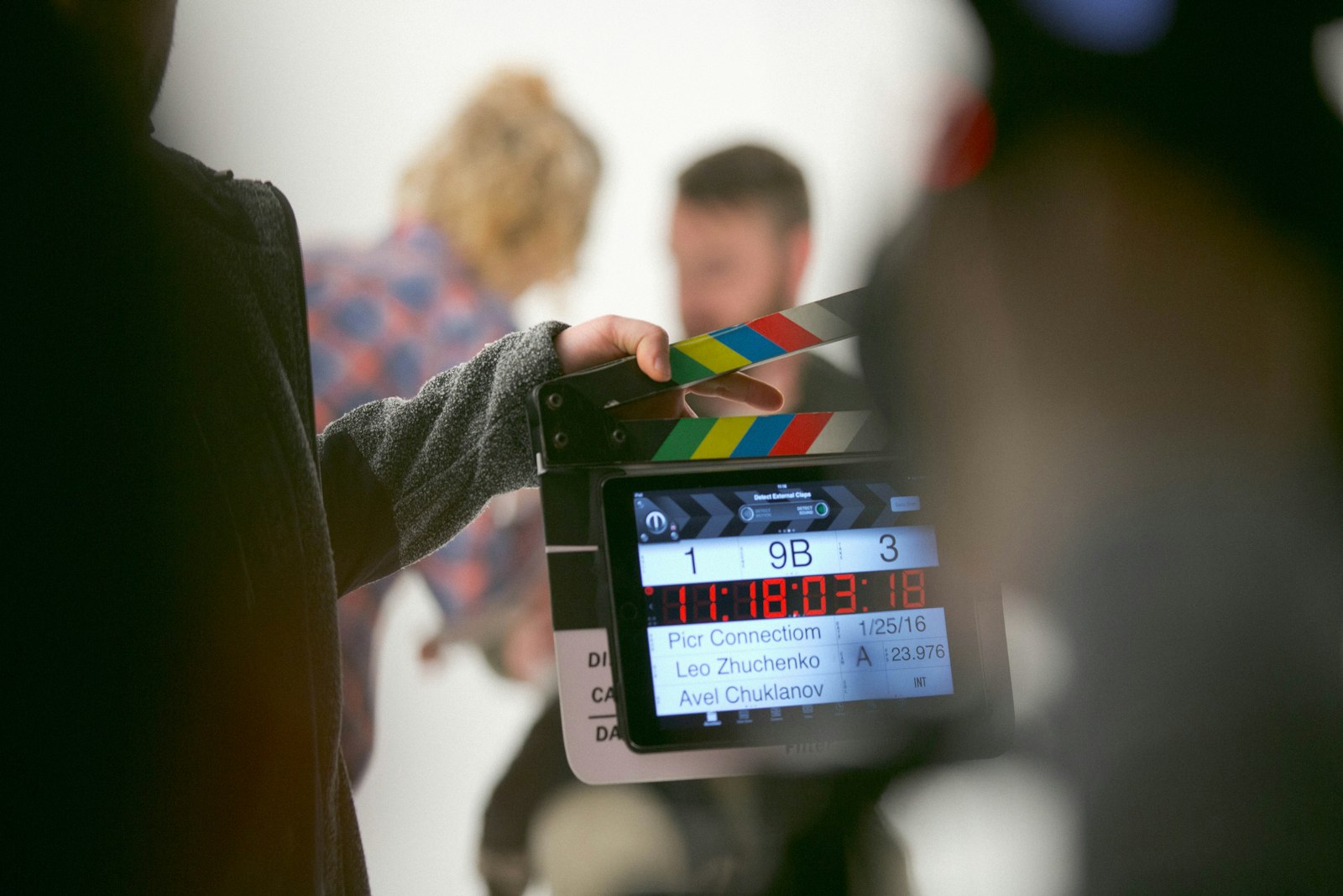Person holding clapperboard