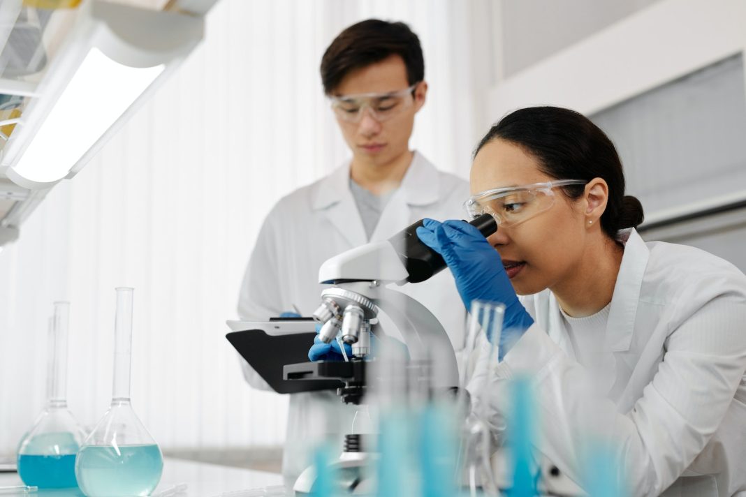 Woman Looking at a Microscope